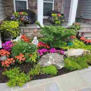 Stone retaining wall built by masonry contractors in Richboro
