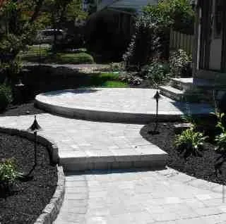 Stone retaining wall built by masonry contractors in Langhorne