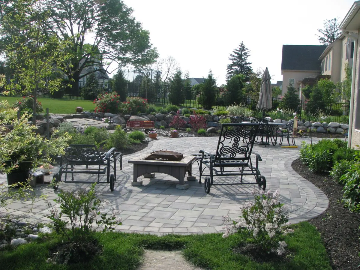 Wrought Iron Lounge Chairs and Fire Pit on Outdoor Patio